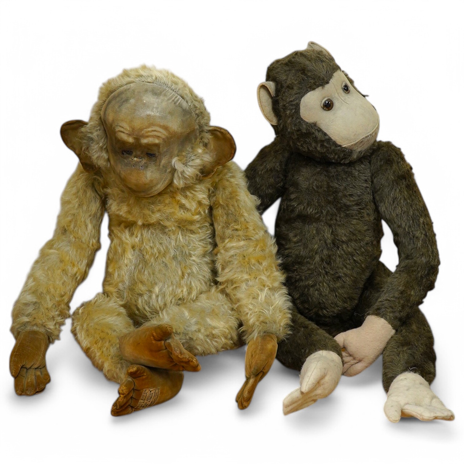 A Merrythought gold mohair monkey, with jointed limbs, and one other jointed monkey, Merrythought 62cm. Condition - poor to fair